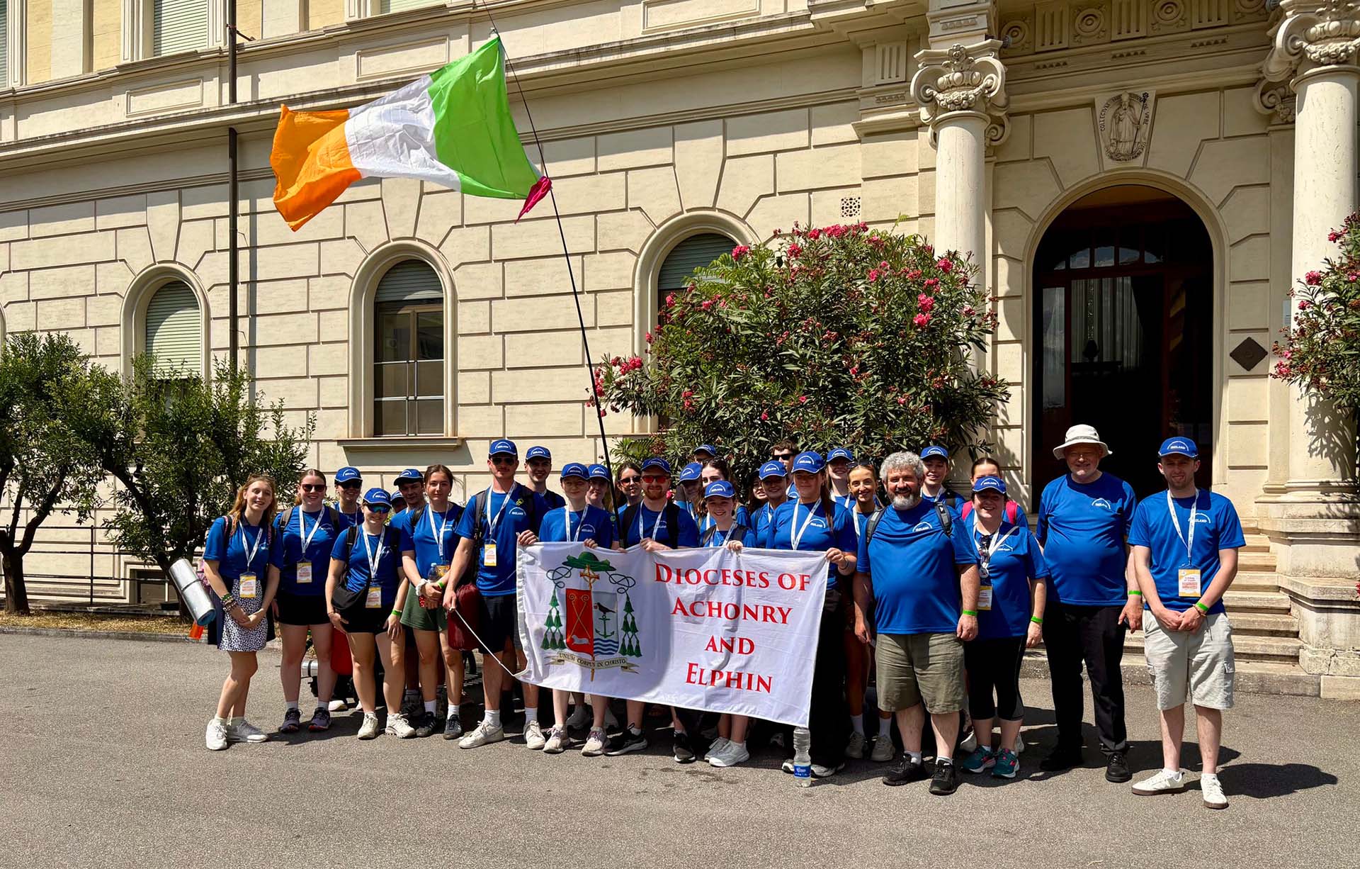 Group of people outside a building, holding a flag: "Dioceses of Achonry and Elphin"